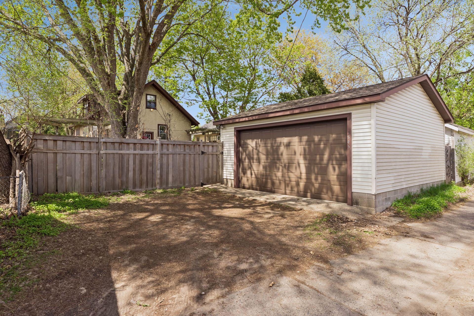 Two car garage + parking space in driveway