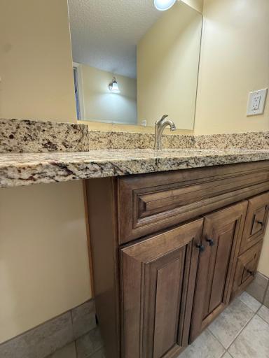 True, spacious vanity with granite in bathroom