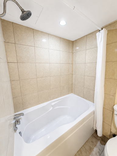 High end, soaking tub and shower combo, tiled bathroom