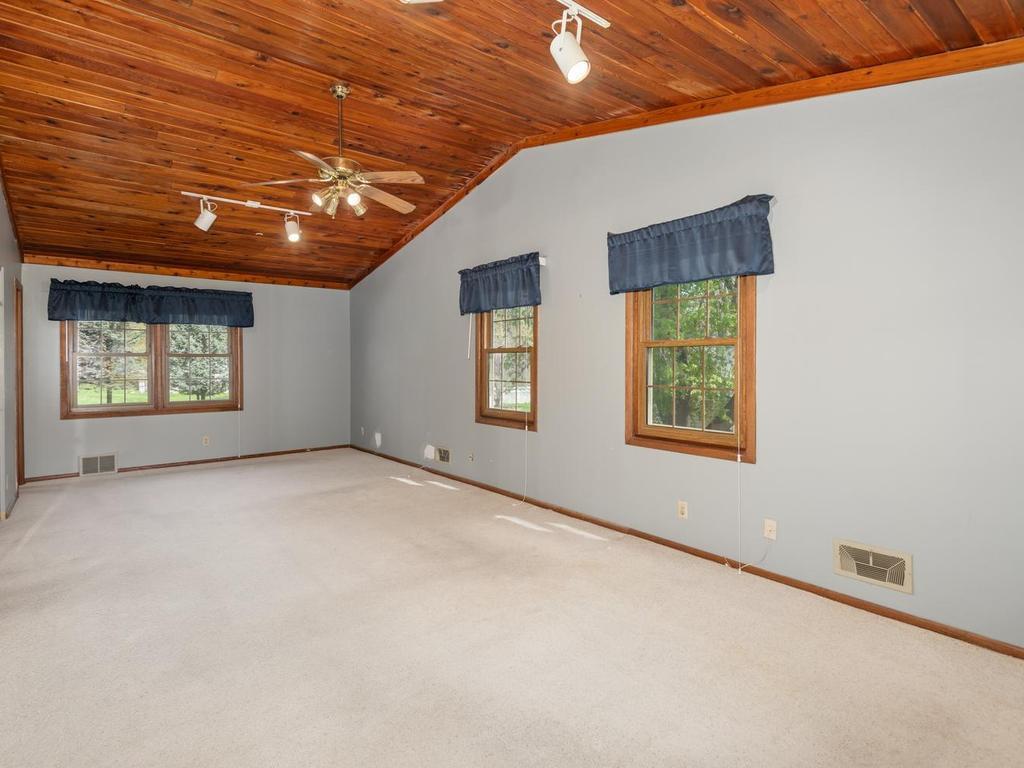 Spacious upper level vaulted Primary Suite has private 3/4 Bath