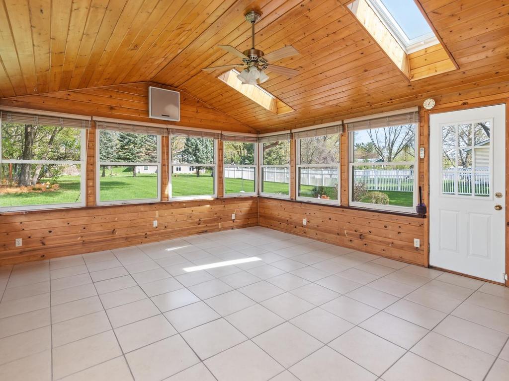 Vaulted Sunroom has in-floor heat and skylights for year-round comfort!