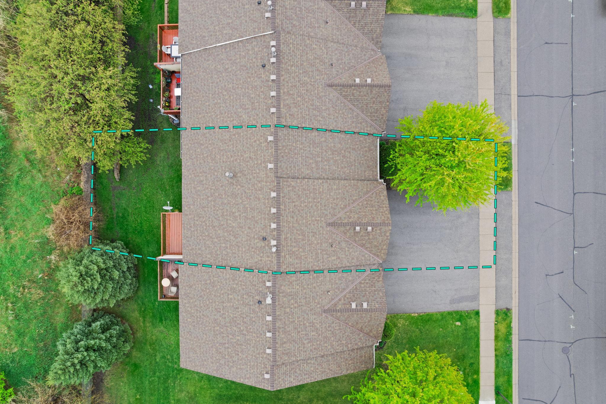 An ariel view of this townhome. The exterior of the homes are well cared for. From roofs, driveways, siding,etc.. it is covered.