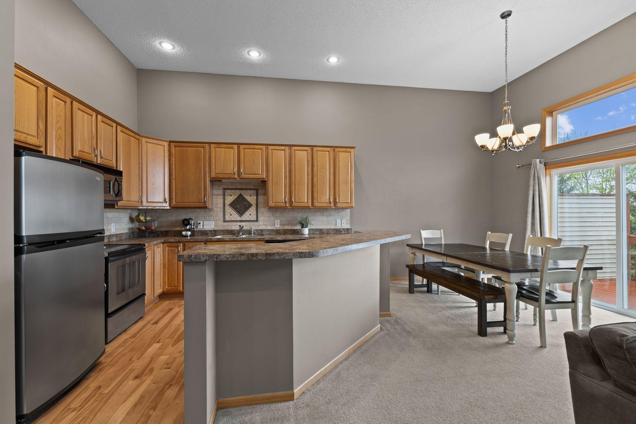 This kitchen is open to the dining area and the living room. This entire level overlooks the backyard. The deck is east facing, so enjoy your mornings watching the sunrise.