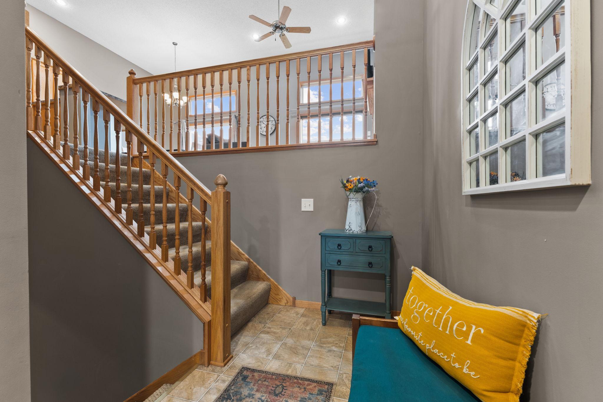 This is an eye-catching layout. You have a large foyer that leads to the this landing. Up the stairs will take you to a room of natural light with floor to ceiling windows, custom built-ins and an open concept.
