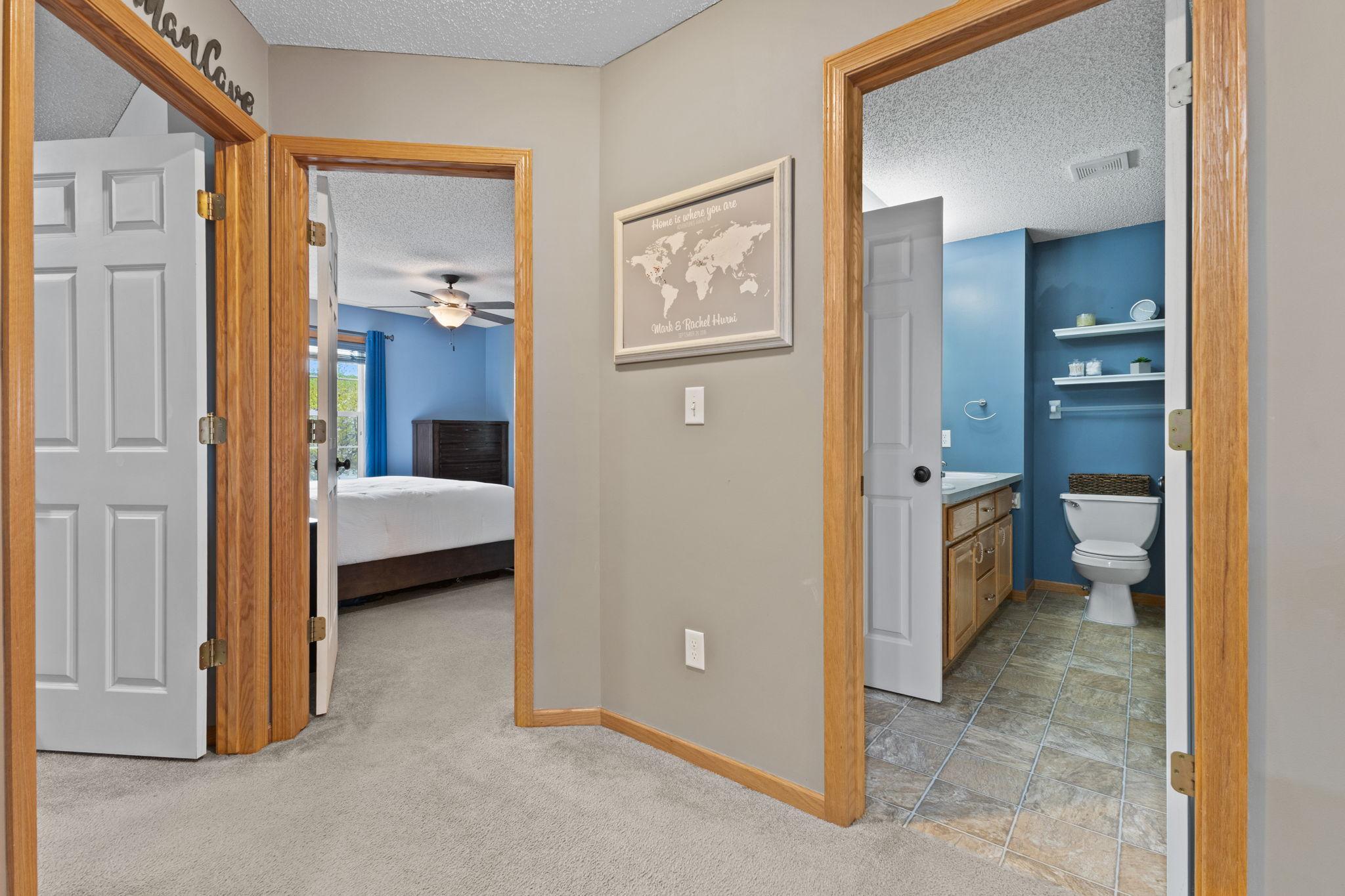 This is the primary bedroom and walk through full bathroom with double sinks and a separate tub and shower.