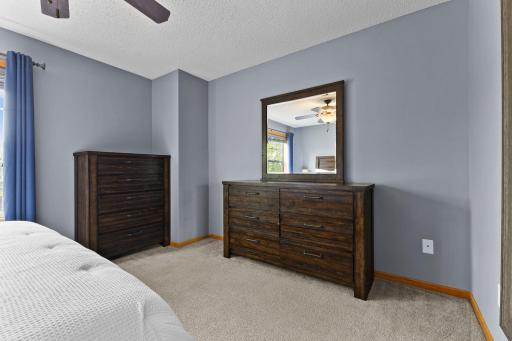 Primary bedroom with a walk in closet.