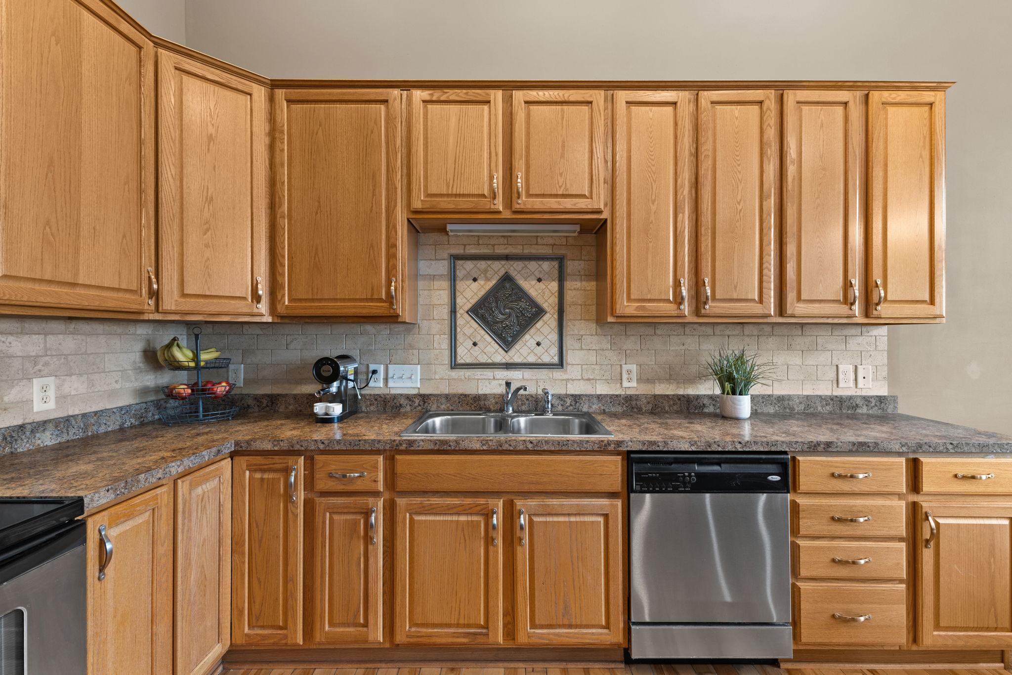 Ample storage and generous countertop space flows nicely between the perimeter and the center island.