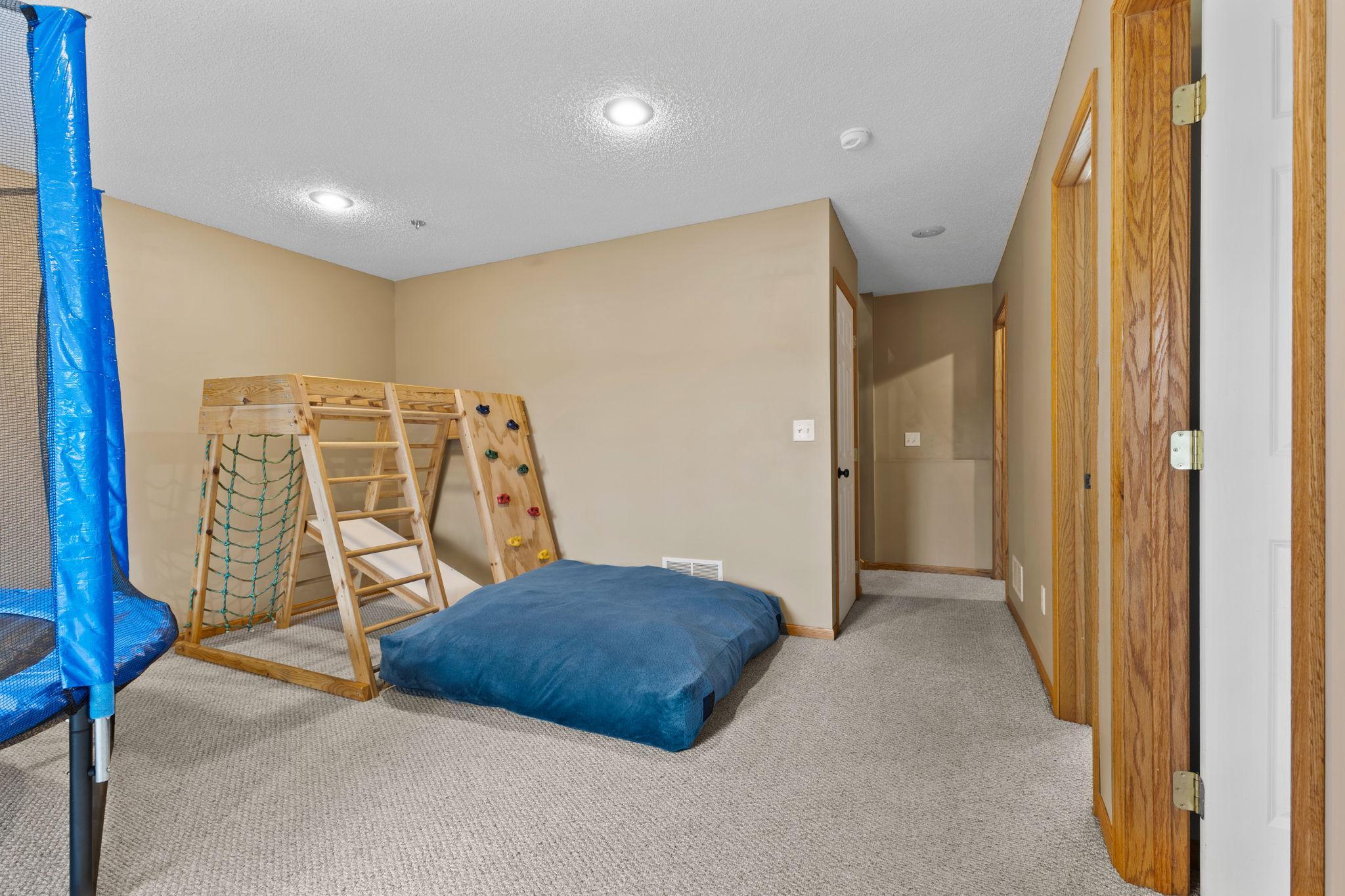 The left of the hallway is under stairs storage and it is a massive amount of space! The open door to the far right is the laundry / mechanicals.