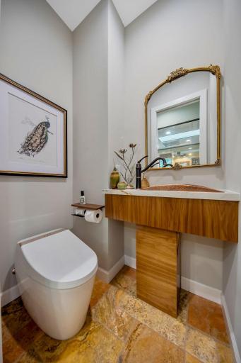 Owners suite water room with bidet/smart toilet and heated floors.