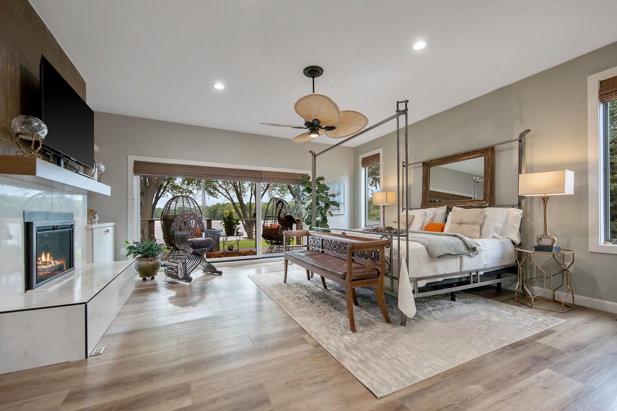 The owner’s suite boasts a marble-surround fireplace, sliding doors leading to a private deck, and a serene spa-like bath that must be seen to be appreciated.