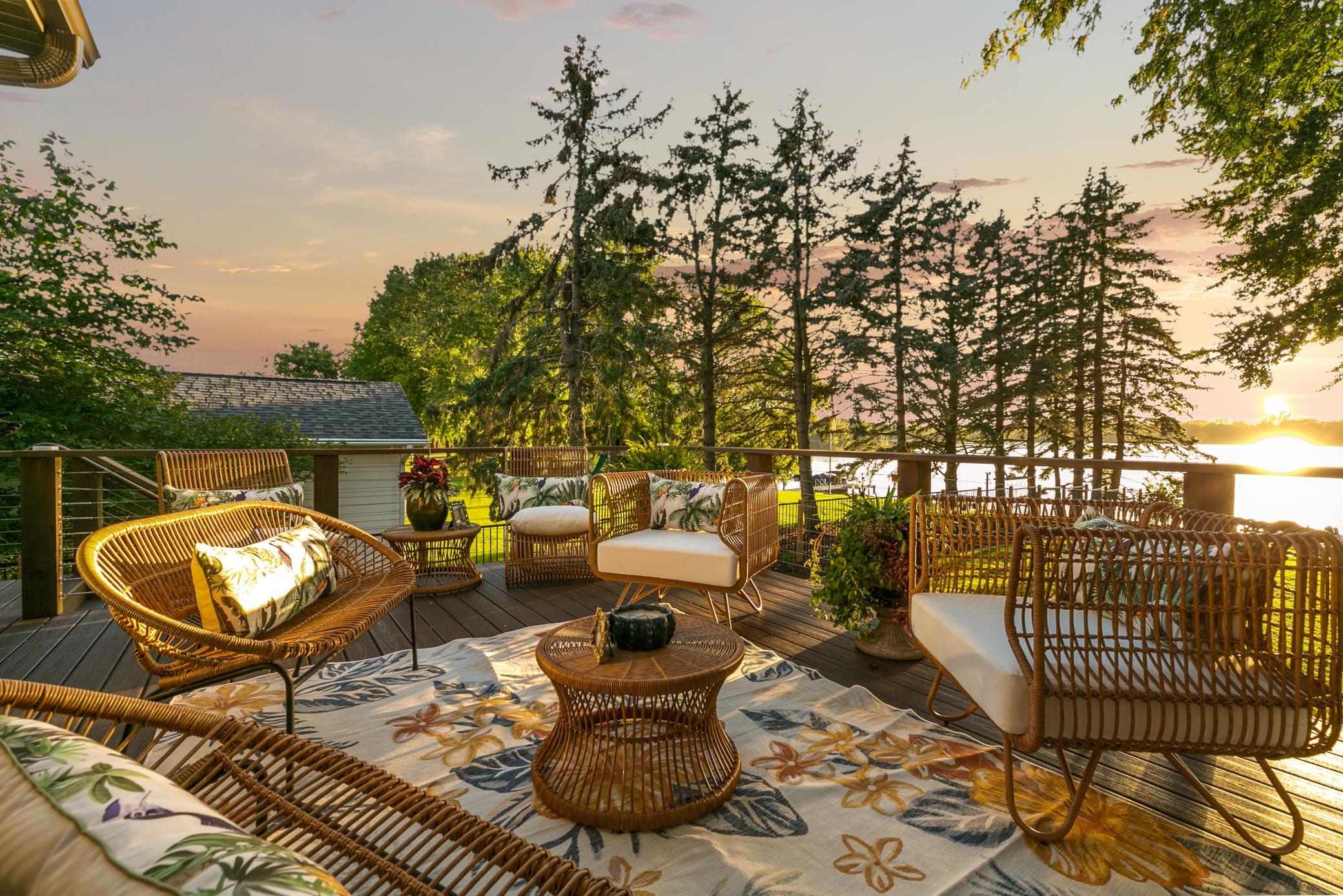 Some homes have views. This one has a setting! A dual set of sliding doors from the formal dining and kitchen lead to the main deck.