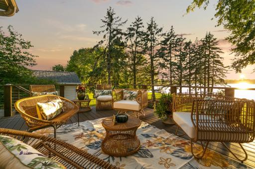 Some homes have views. This one has a setting! A dual set of sliding doors from the formal dining and kitchen lead to the main deck.