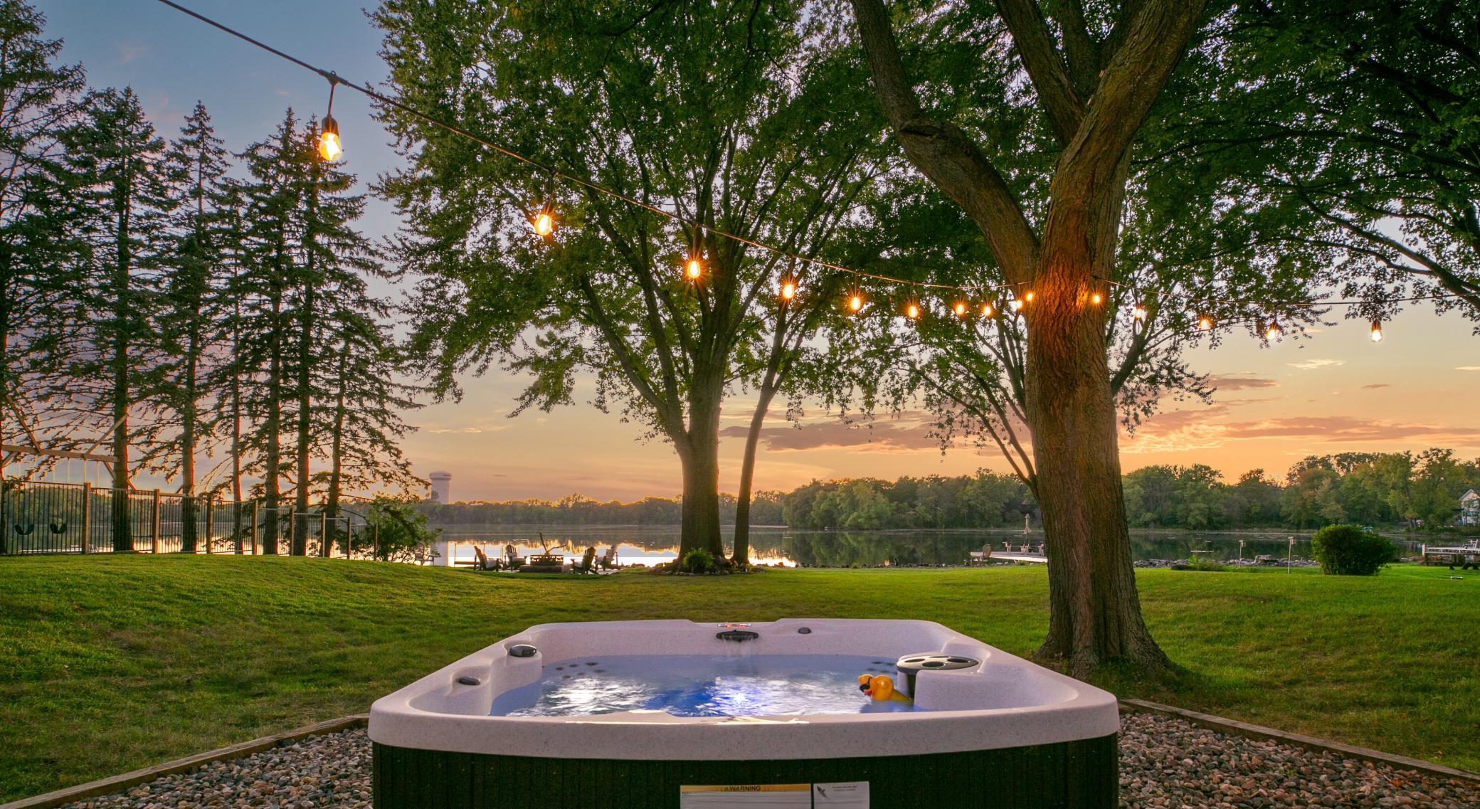 Savor the breathtaking evening skyline while relaxing in the hot tub.