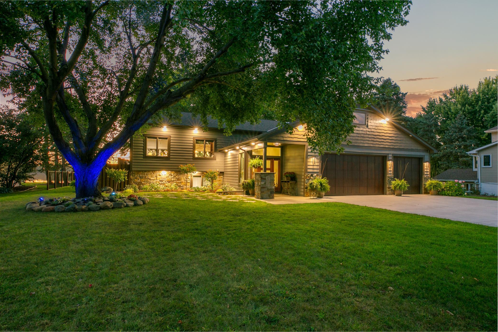 A covered front porch combined welcomes you home. The entire exterior is has upgraded with LP siding, real natural stone accents. Teak oversized garage doors open to a 768 sq ft fully insulated, heated garage plus a new concrete drive (fall 2024).