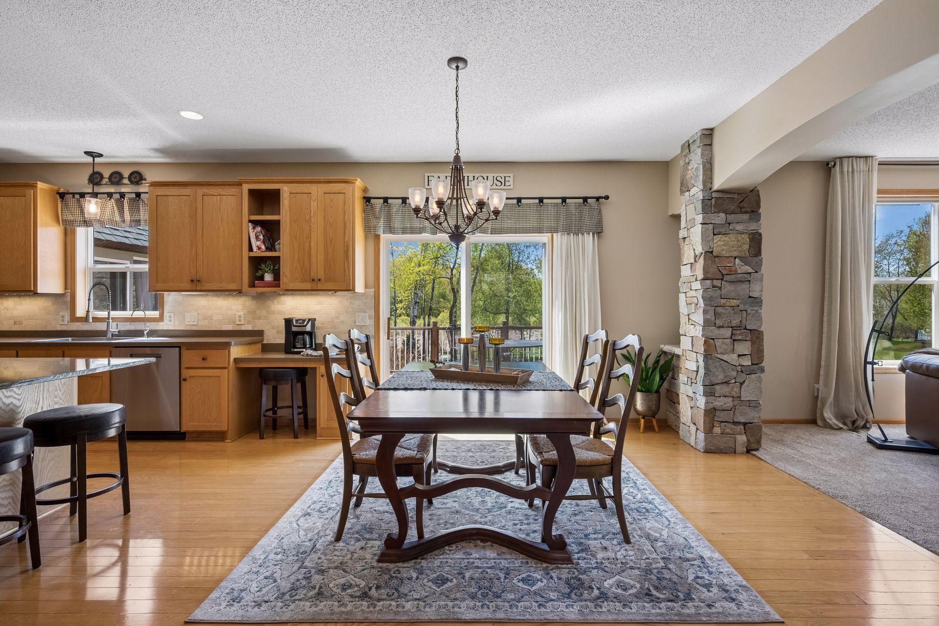 Bright open-concept dining space with easy flow to the living room and deck.