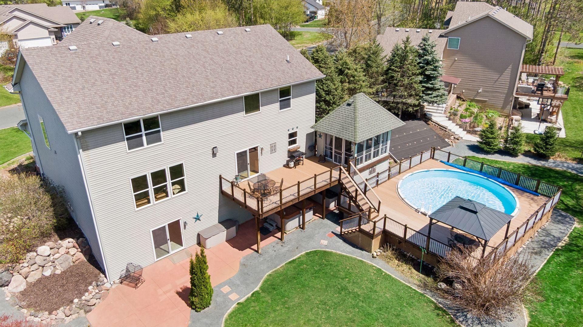 Resort-style living with a pool, hot tub, and expansive deck. This beautifully maintained home offers the perfect blend of privacy, relaxation, and outdoor entertaining. Enjoy the added convenience of raised bed gardens.