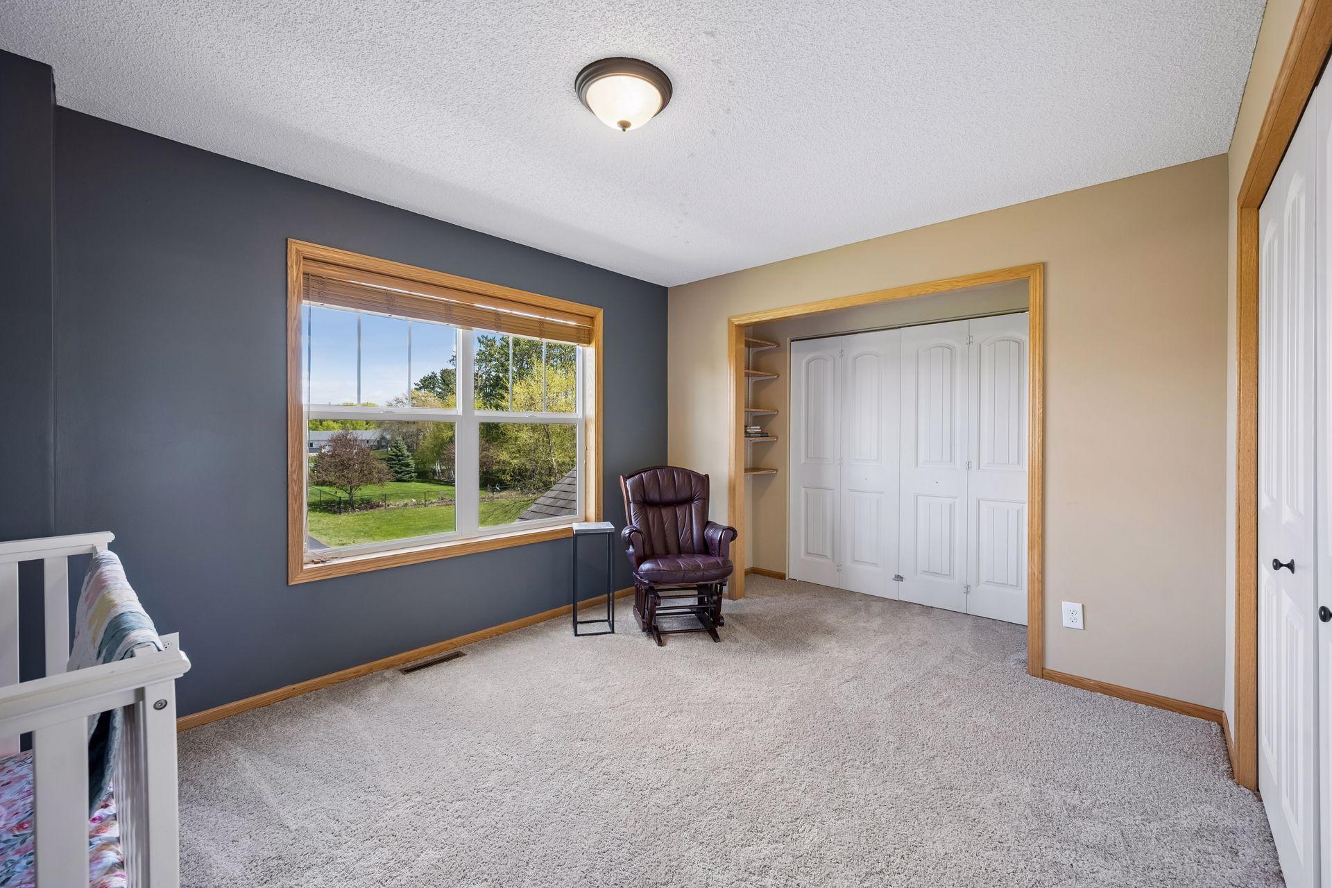 another view of combined bedrooms with closet doors closed