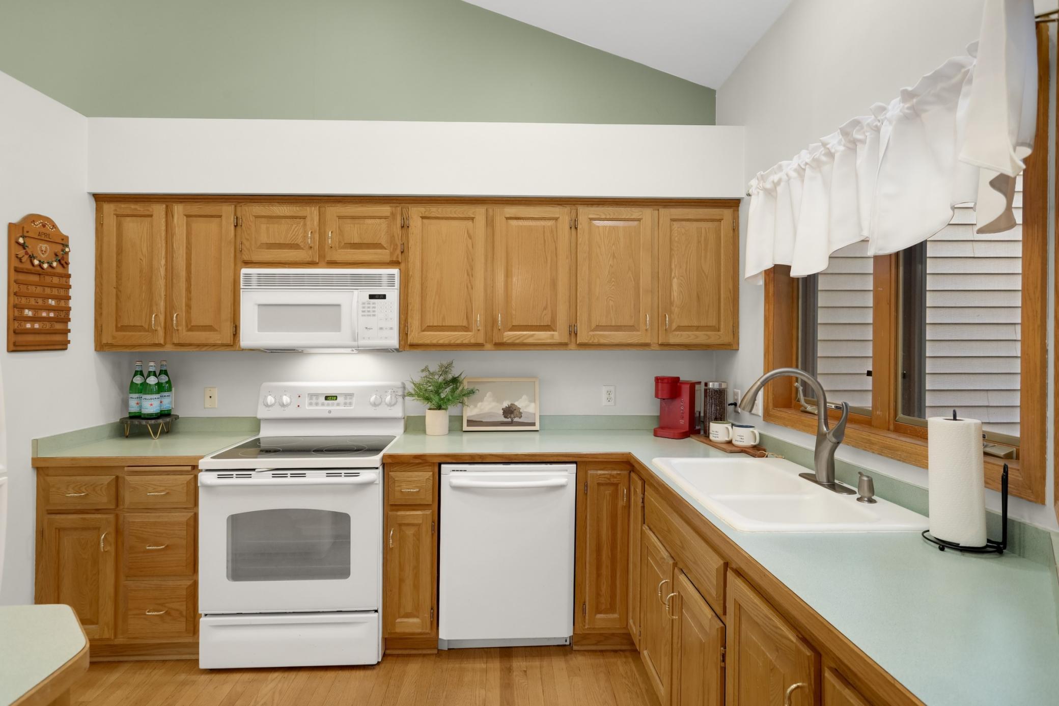 This lovely kitchen overlooks the living spaces and the front of the home.