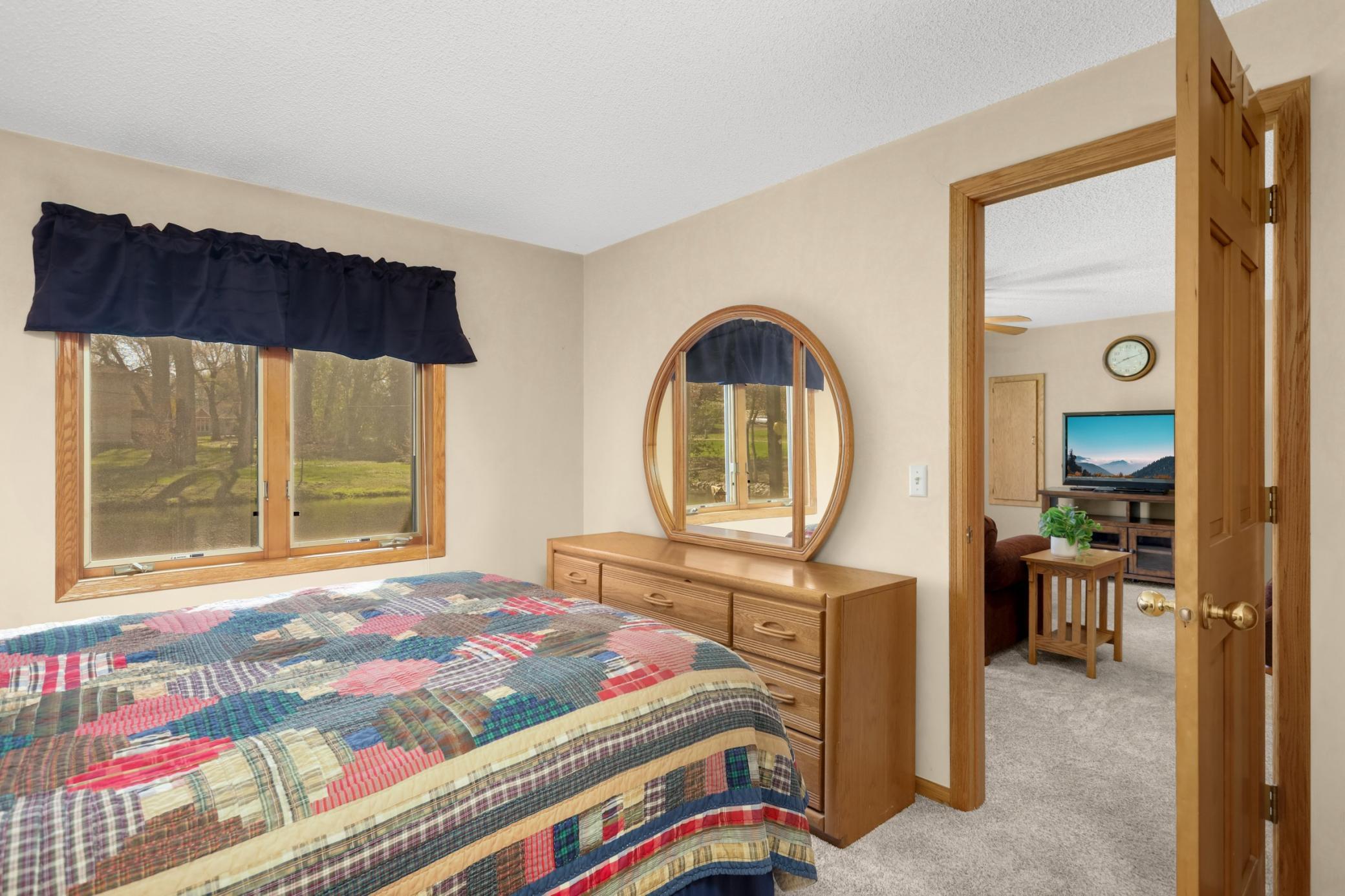 The spacious lower level bedroom is perfect for guests.