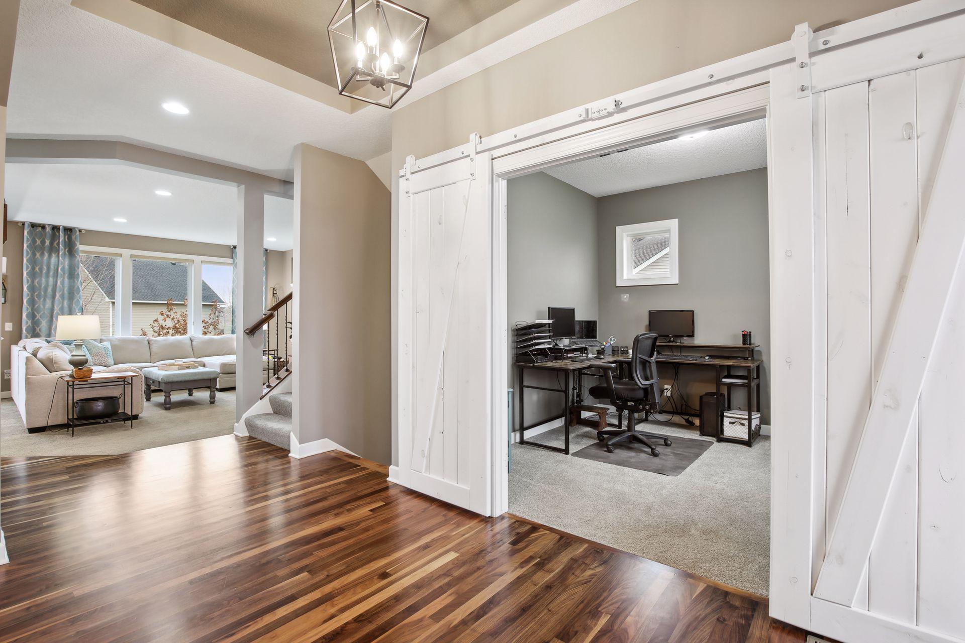 The sliding barn style doors give the perfect option for privacy while keeping the flow of the open concept.