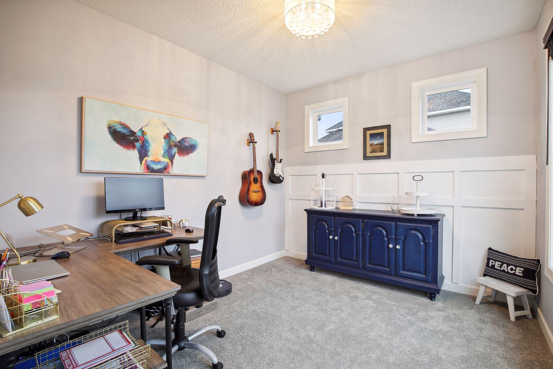 This sunroom off the kitchen overlooks the back yard and makes a great sitting room, office, playroom or special use for your families needs.