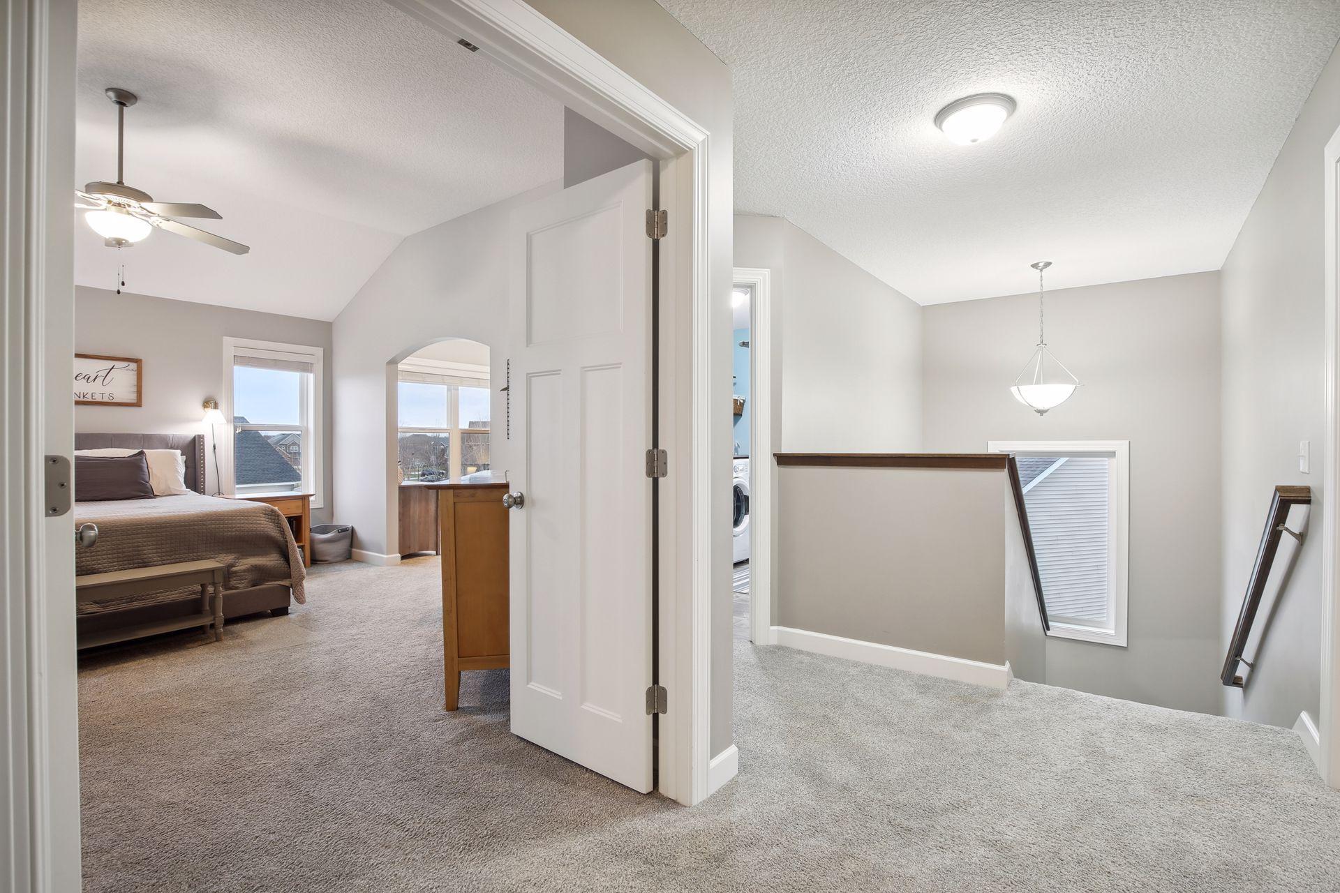 The primary suite is on the upper level and located next to the upper level laundry.