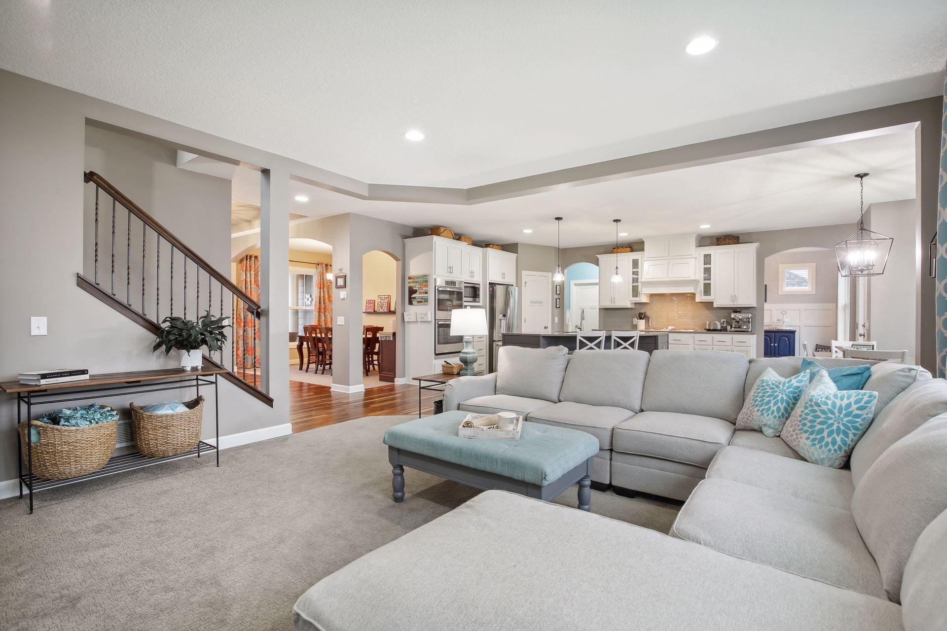 Lovely gathering space flows effortlessly into kitchen and formal dining.