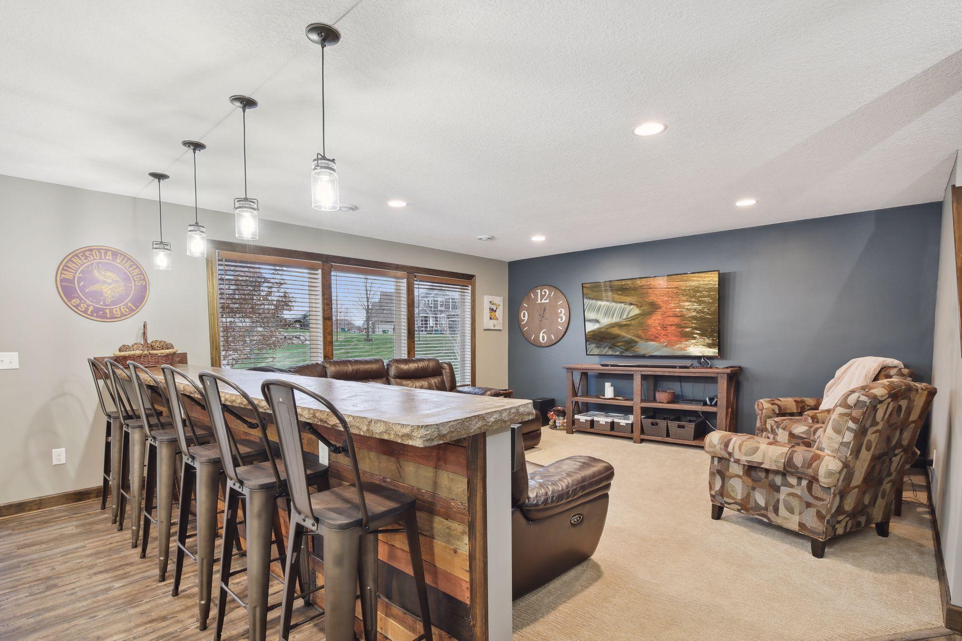 Lower level family room is set up for fabulous family fun or entertaining.