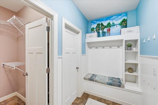 Mud room suite has custom lockers and shelves