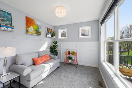 Sun room off the kitchen overlooks the deck