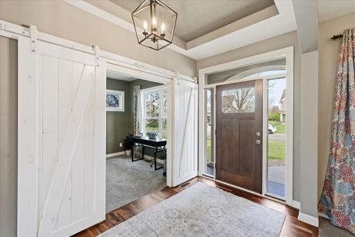 The custom sliding doors offer an option for privacy in this transitional space while keeping the flow of the open concept.