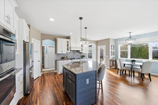 Just off the already beautifully designed kitchen, a thoughtfully appointed mudroom suite adds both style and everyday functionality.
