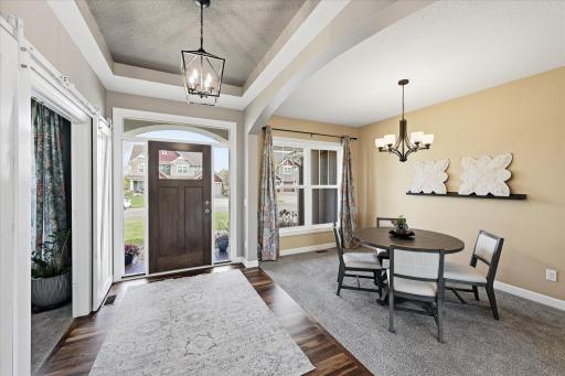 Attractive foyer has plenty of gathering space for greeting friends or family.