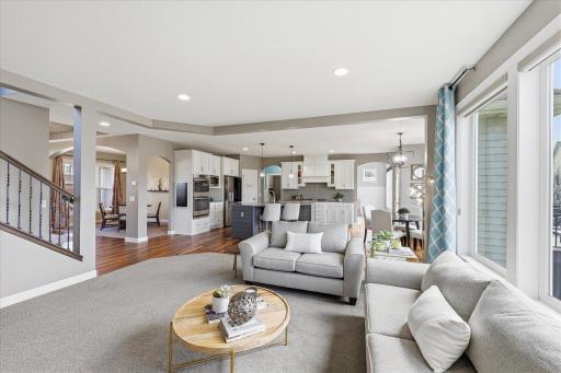 Lovely gathering space flows effortlessly into kitchen and dining areas.