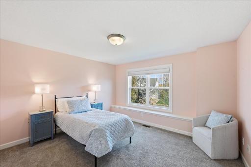 Bedroom 2 on the upper level has an en suite bath