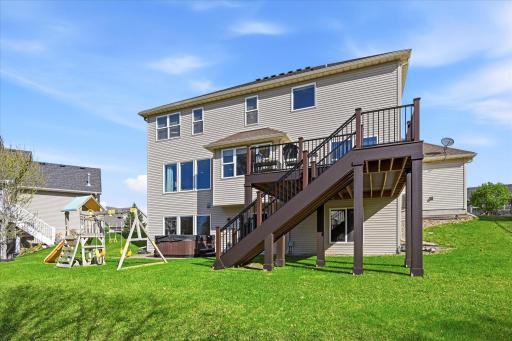 Access the yard and home with this generous composite deck and stamped patio area.
