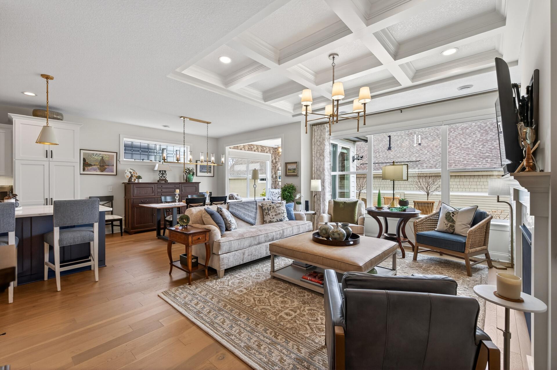 The special attention to the details in the coffered ceiling meets floor to ceiling windows with custom treatments