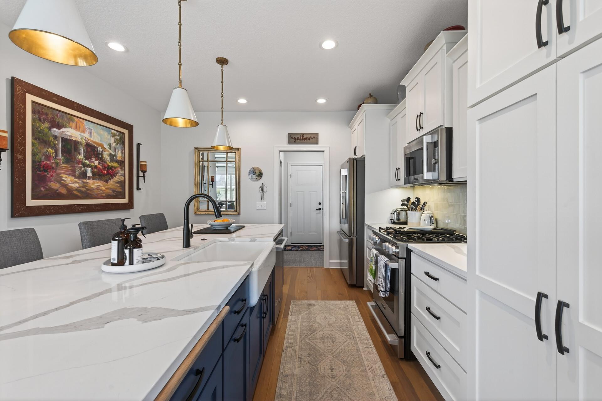 The smart kitchen design features large drawers and roll out drawers in the cabinets