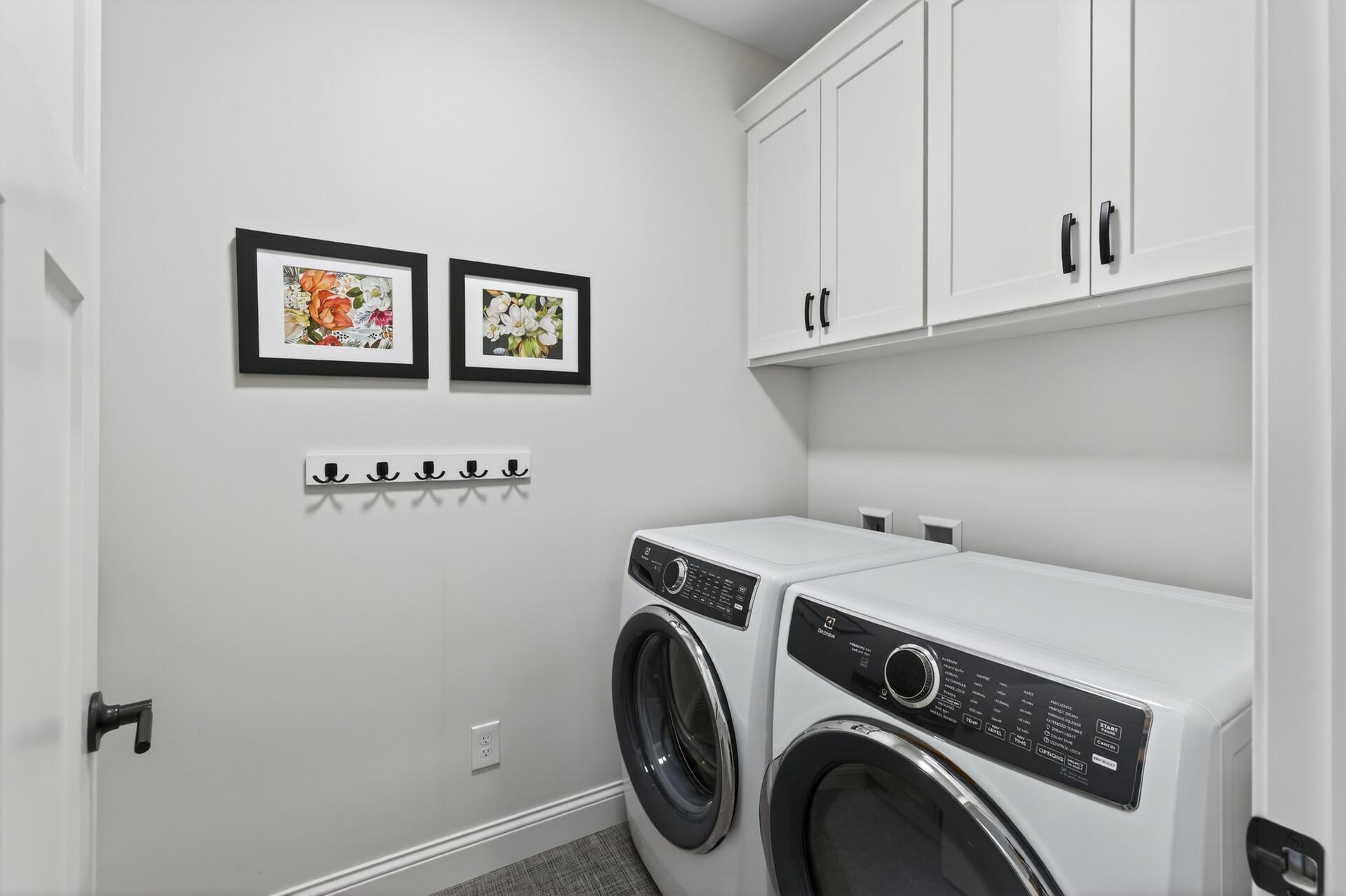 Main-floor laundry room with connter, cabinets and a sink (not pictured)