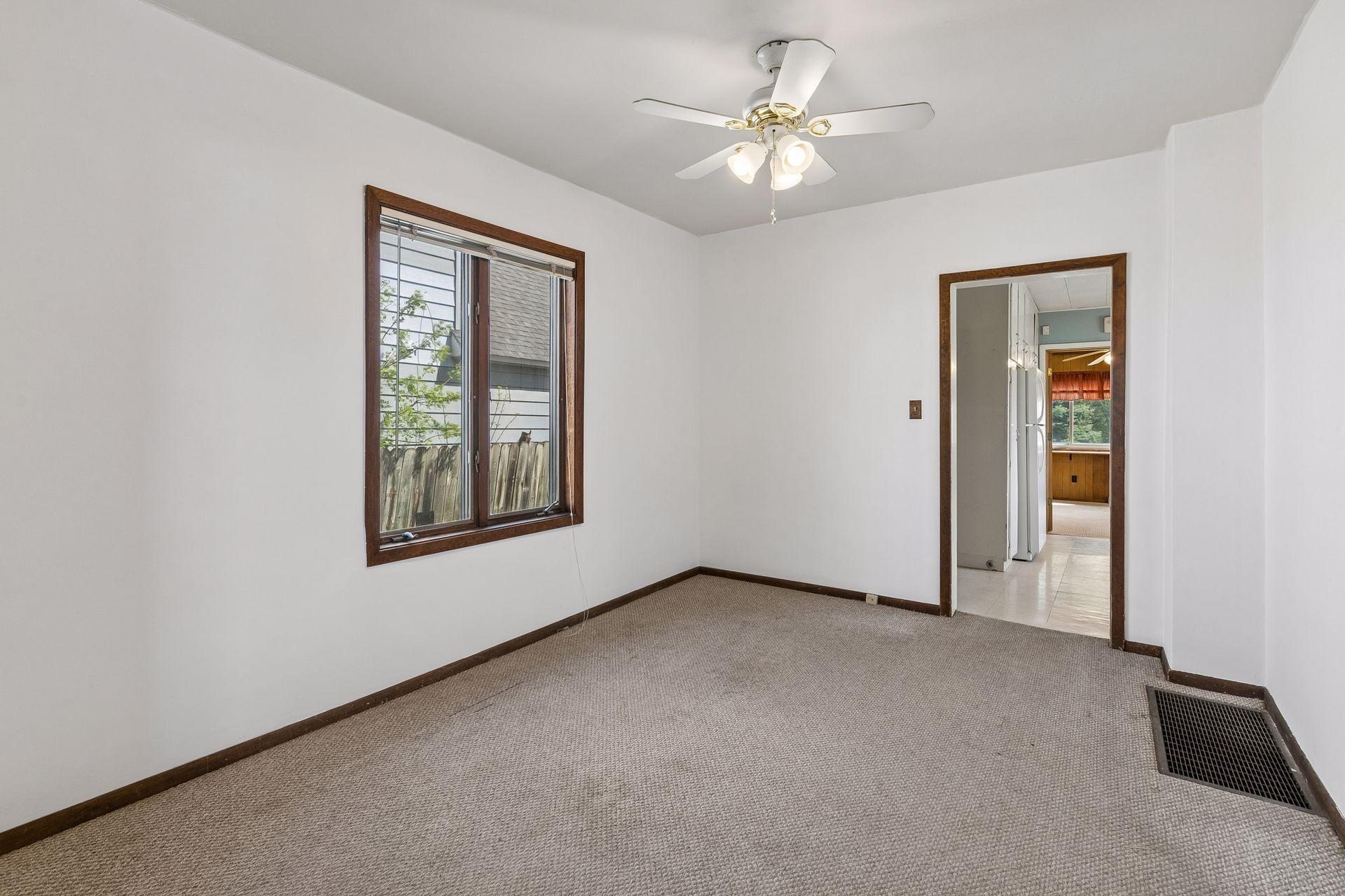 Potential dining space flows from living space to kitchen