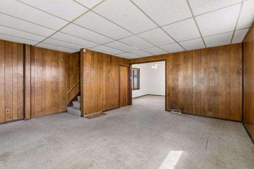 Main level living space flows into flex space that could be used for dedicated dining