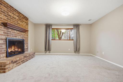 Lower level family room with brick fireplace!