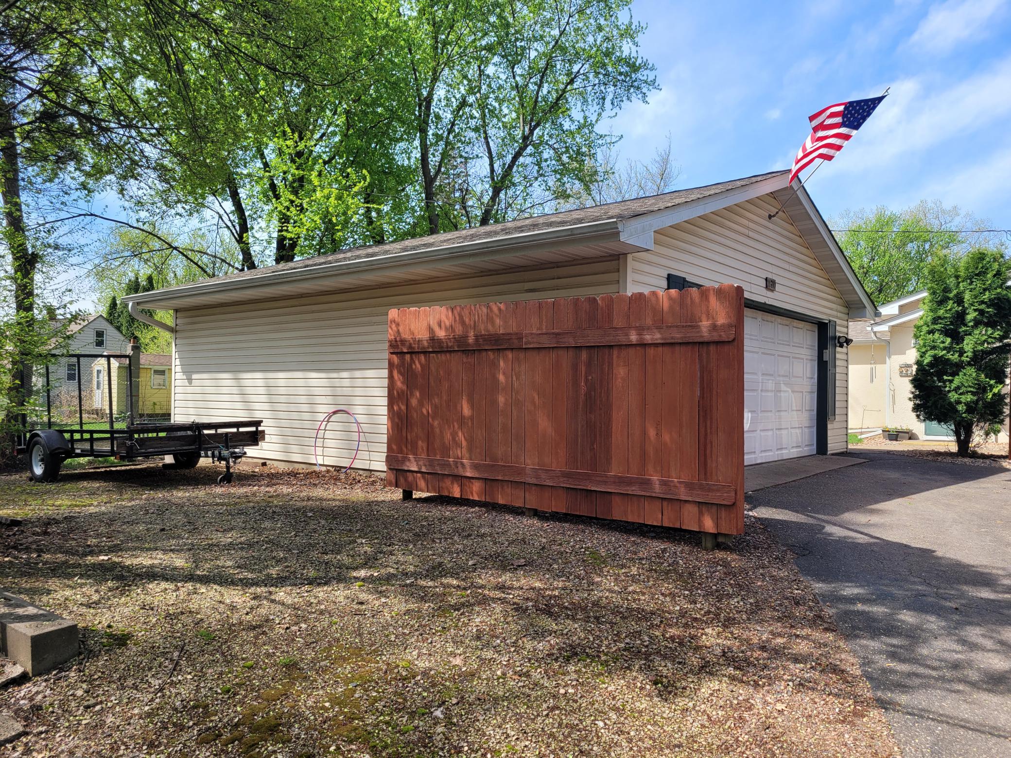 Plenty of parking at side of the garage for a boat, motorhome or toys.