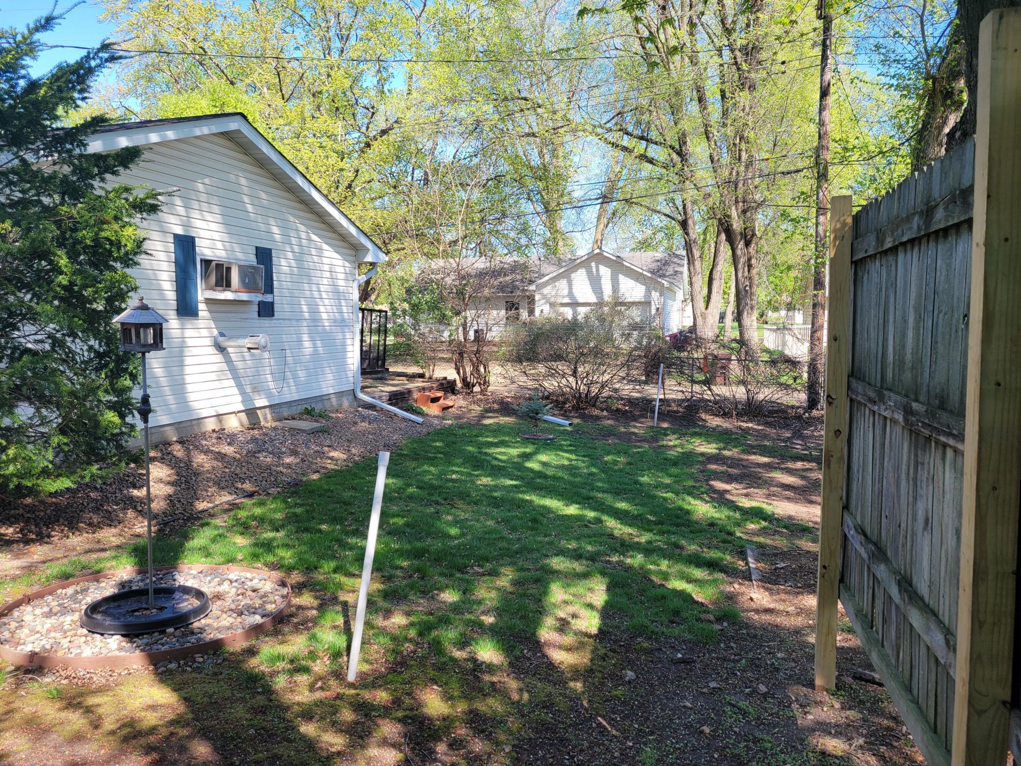 Side yard in back of garage.