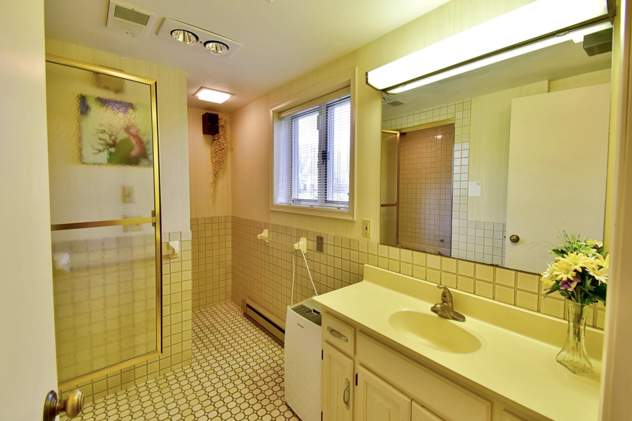 Bathroom 4 with steam shower off of Activity room
