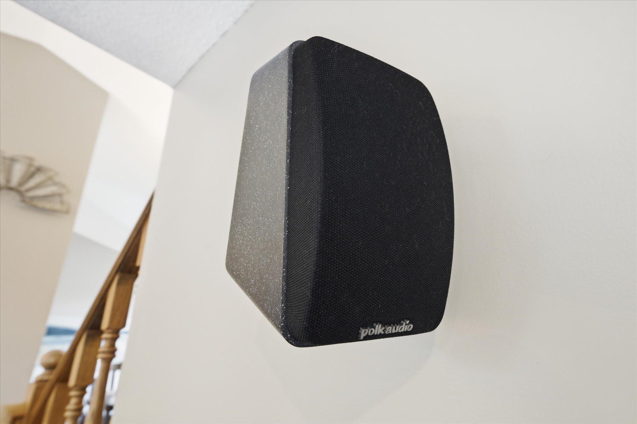 The surround sound speakers in this family room are indeed included.