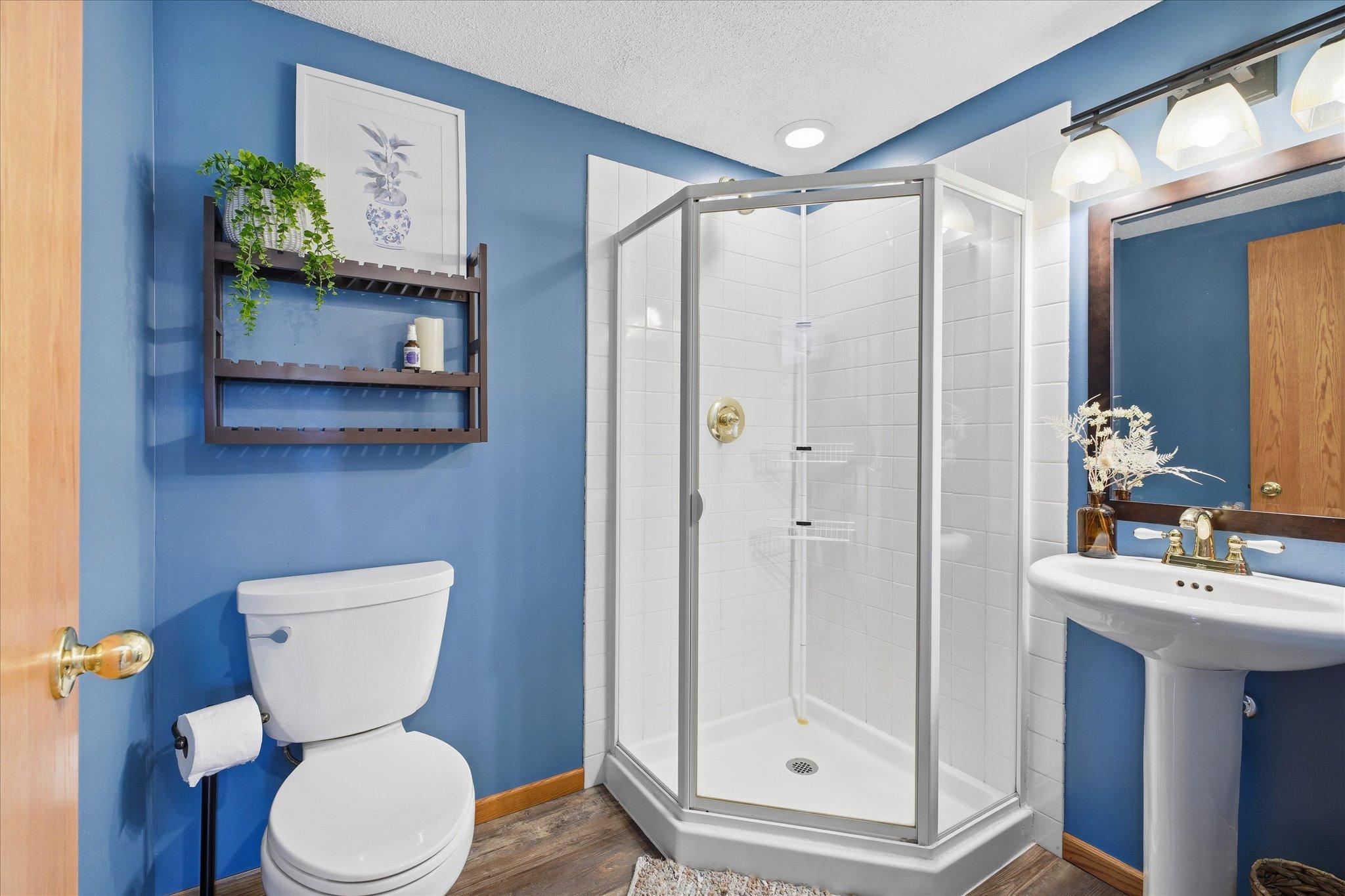 This main level bathroom has a walk-in shower!