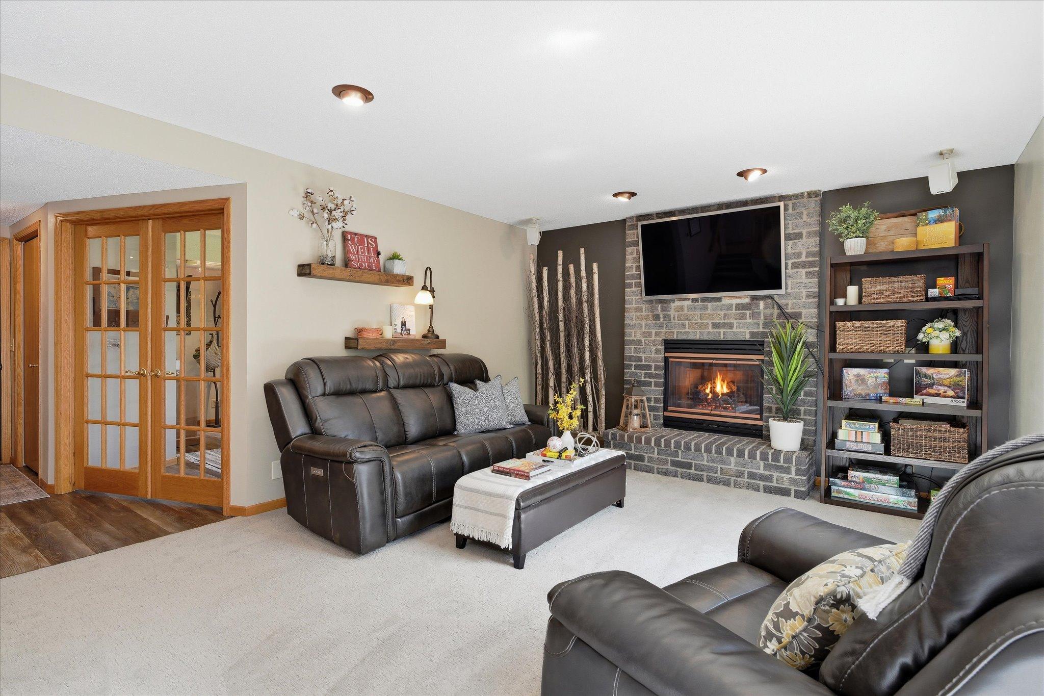 The carpet & paint are fresh & neutral. The vinyl plank flooring is a recent update too. Aren't those French doors gorgeous?
