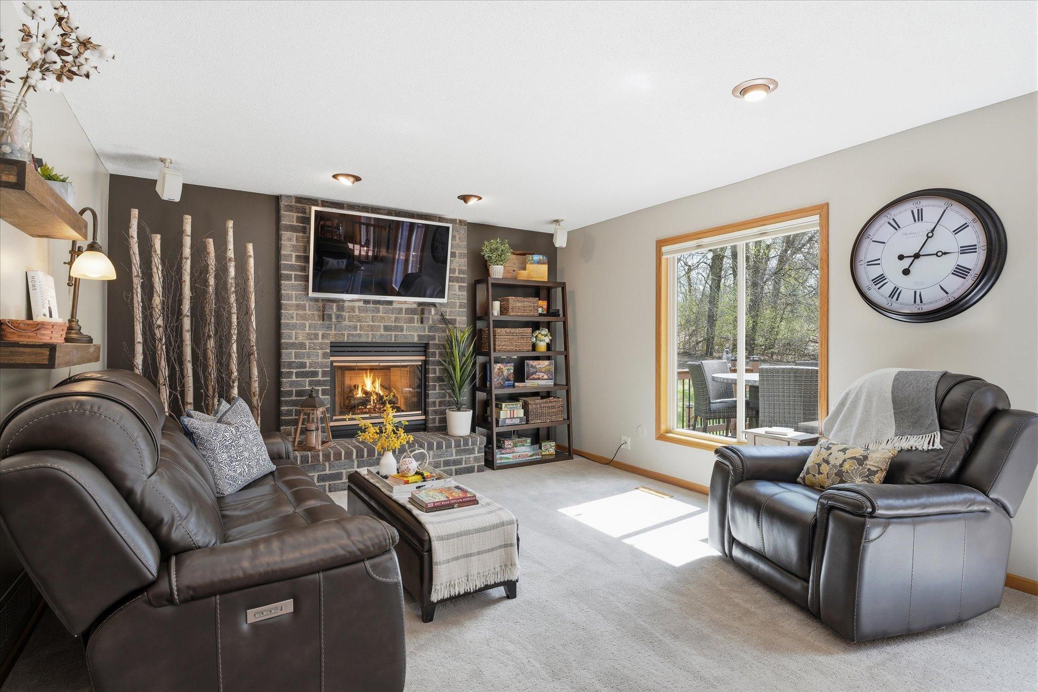 That window has a cordless, top-down/bottom-up shade too. And the floor-to-ceiling, brick-surround gas fireplace will help you stay toasty when that Old Man Winter guy comes back around in six or seven months.