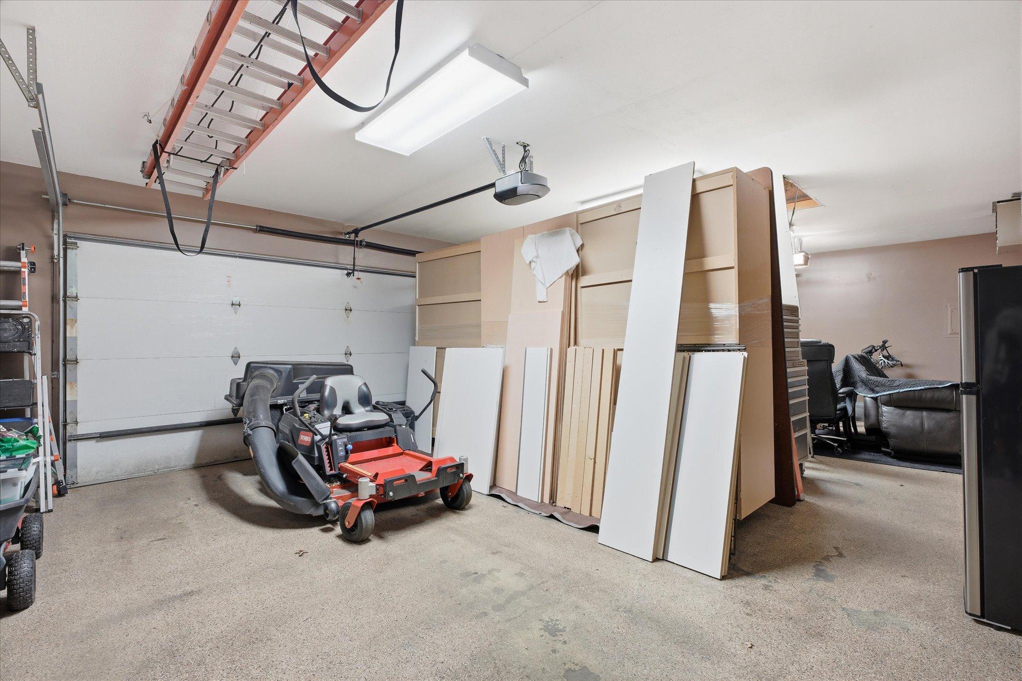 The XL three care garage is heated & insulated, has epoxy floors, insulated doors new in 2007, and has finished walls & ceilings too. Oh, and it also has a pull-down storage system and a MyQ belt-drive opener w/keypad.